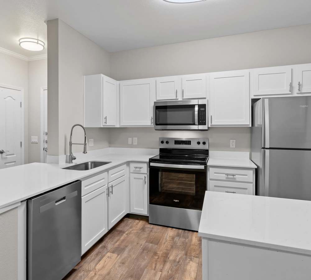Kitchen with stainless-steel appliances at Cortland Village Apartment Homes in Hillsboro, Oregon