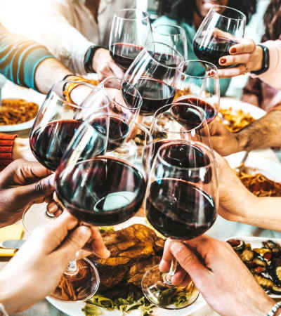 A group of friends having a toast out for dinner near Gateway Plaza Apartments in Portland, Oregon