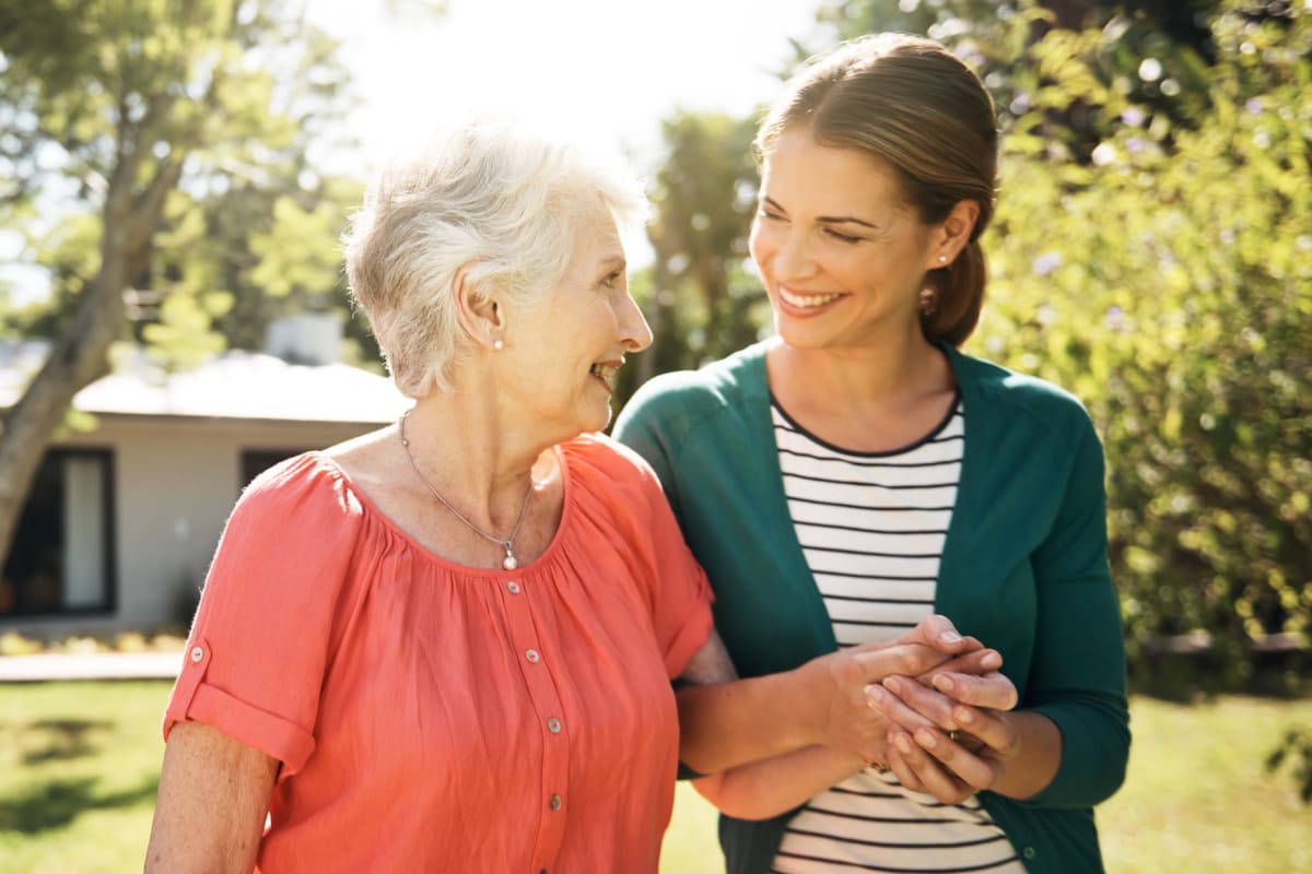 Resident walking with her daughter at a MBK Senior Living community