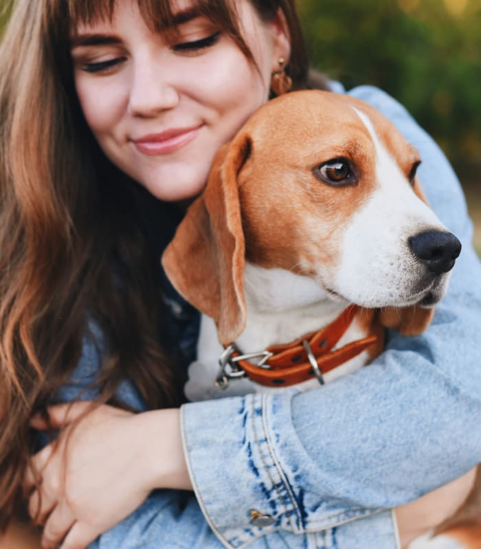 Resident hugging her dog at Newport Wichita in Wichita, Kansas