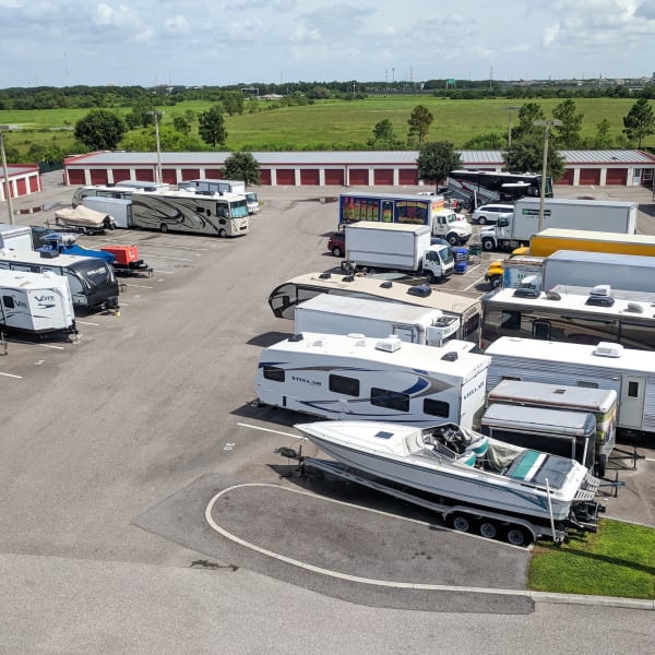 RVs, boats, trucks, and trailers parked at StorQuest Self Storage in Sarasota, Florida