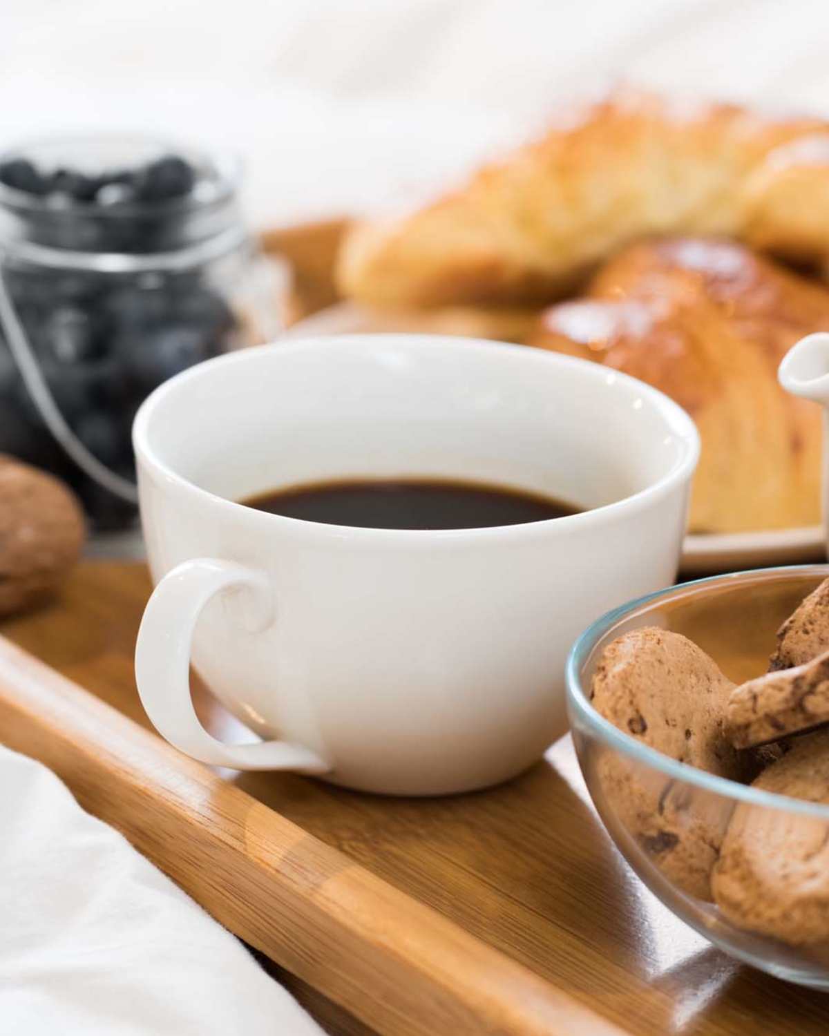 Breakfast tray on the bed in an apartment home at 300 Optimist Park in Charlotte, North Carolina 