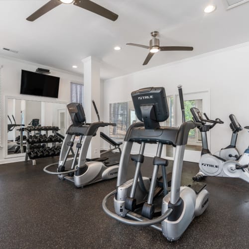 Weights and cardio equipment in the fitness center at Mission University Pines in Durham, North Carolina