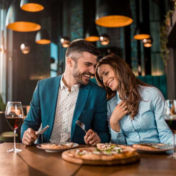 Resident couple having lunch at restaurant near Grand Fountain in Richmond, Texas