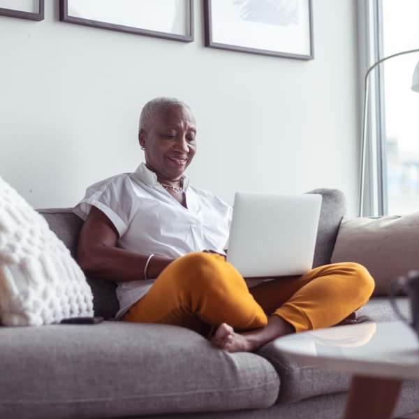 A resident works from her sofa in her apartment at Magnolia Run, Virginia Beach, Virginia