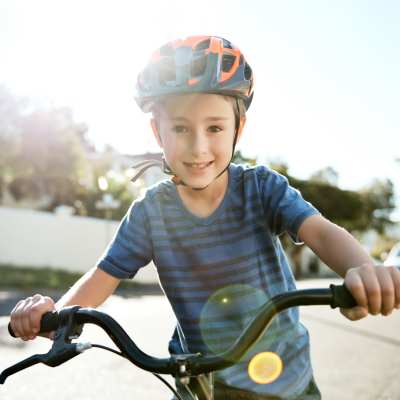 A resident child riding his bike near Century Stone Hill South, Pflugerville, Texas