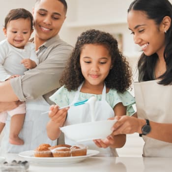 Family cooking together at Ashland Garden in San Lorenzo, California