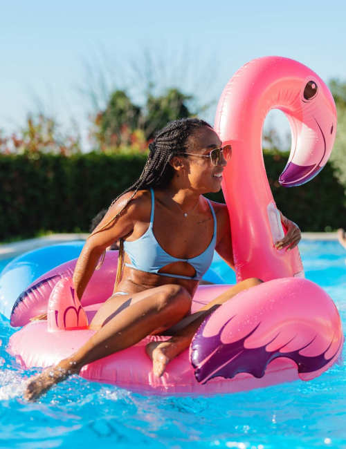 A smiling resident in a pool at Falls Creek in Sanford, North Carolina