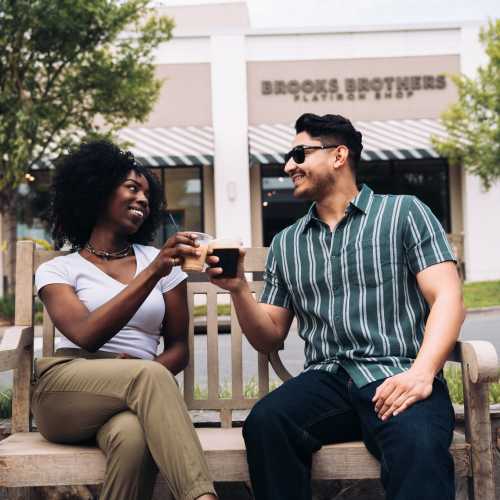 Friends raising a toast at a restaurant near The Maximillian at Stonefield in Charlottesville, Virginia