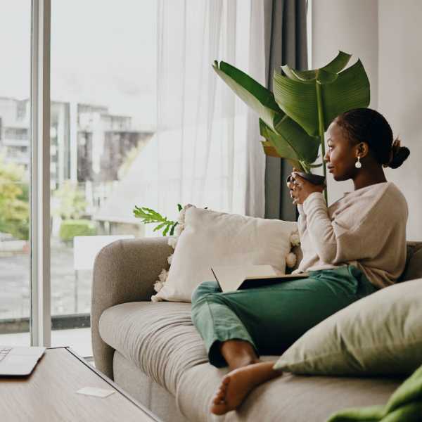 A resident sips coffee in her apartment at The Amber at Greenbrier, Chesapeake, Virginia