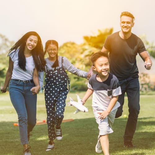 A family playing at a park near Dahlgren Townhomes in Dahlgren, Virginia