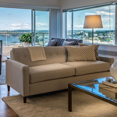 Modern living room with beautiful view at Panorama Apartments in Seattle, Washington