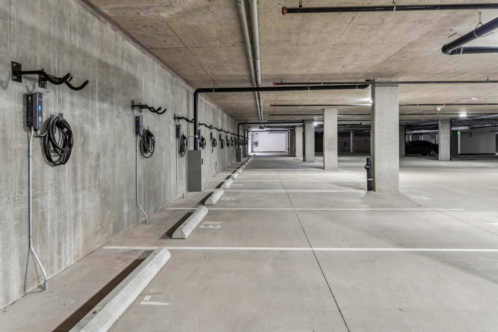 Parking garage with charging stations available at Traxx Apartments in Mountlake Terrace, Washington