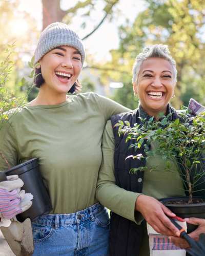 Women holding her plants outside at Vintage at Redfield in Reno, Nevada