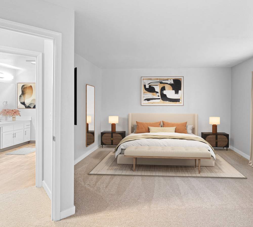 Spacious bedroom with a bathroom across the hall at Waterhouse Place in Beaverton, Oregon