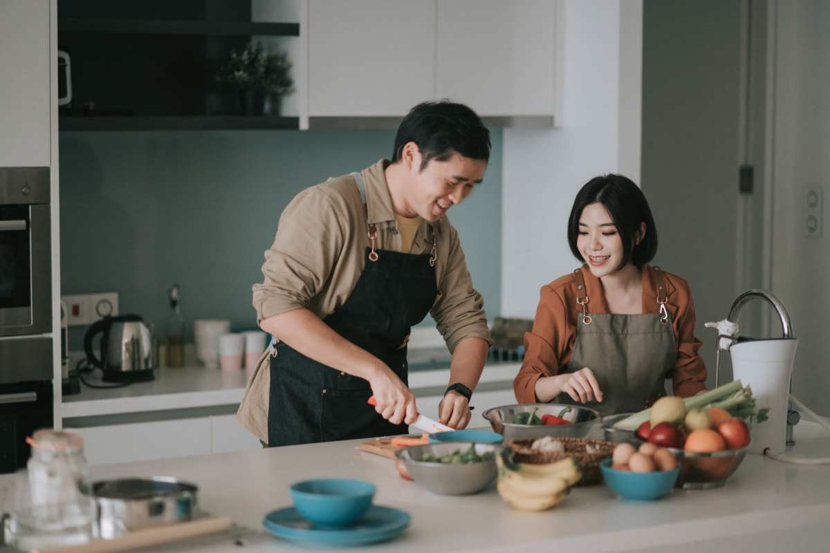 Couple cooking in modern kitchen at Mamook Tokatee in Portland, Oregon