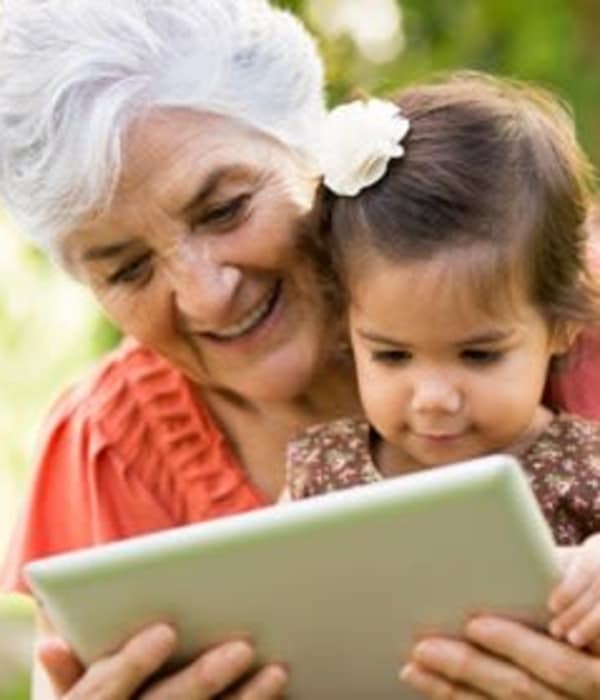 Woman reading to a child at The Phoenix at Lake Joy in Warner Robins, Georgia
