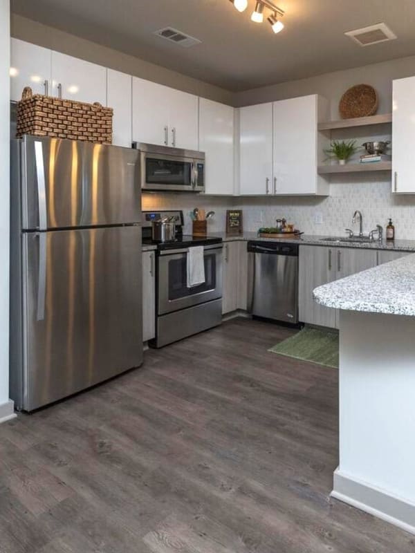 Luxury kitchen with stainless-steel appliances and white cabinetry at Mariner Grove in Savannah, Georgia 