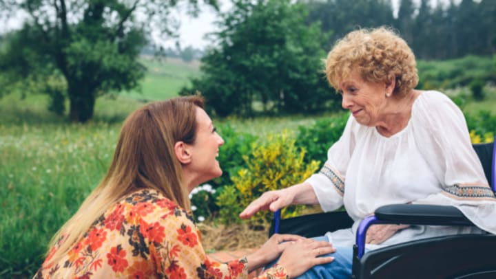 woman talking with an elderly 