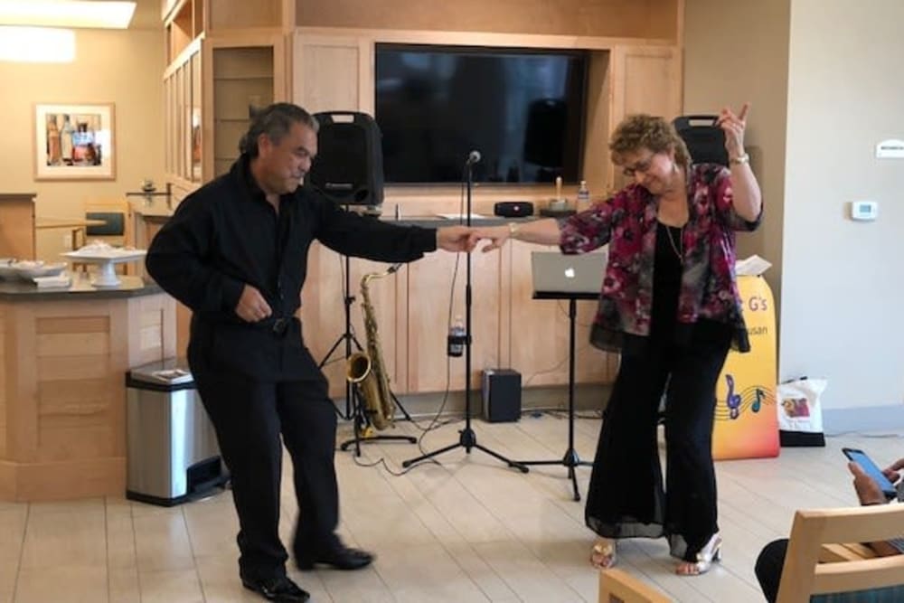 Residents dancing at Merrill Gardens at Rockridge in Oakland, California. 