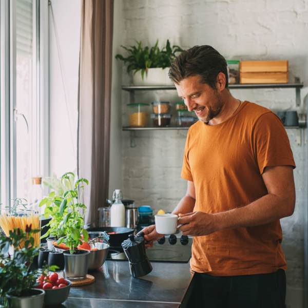 A resident makes coffee in his kitchen at Magnolia Run, Virginia Beach, Virginia