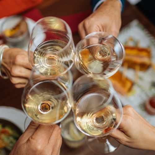Friends having drinks at a restaurant nearby Emerald Grove in Orlando, Florida, 