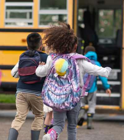 Kids going to school by bus at Citrus Run Apartments in Tampa, Florida