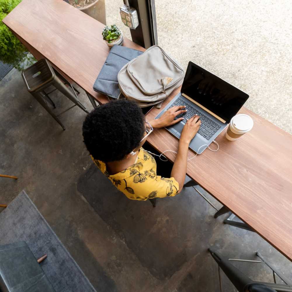 Resident working on her laptop near Bana At Tujunga in Tujunga, California