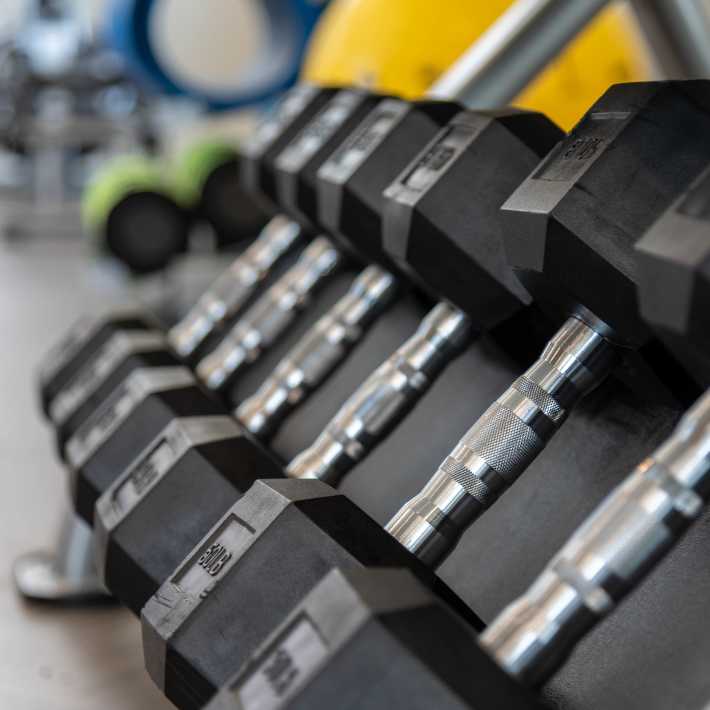Fitness center with free weights at Pinnacle Apartments, Hampton, Virginia