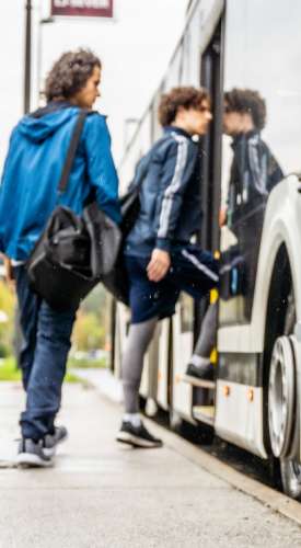 Resident children boarding their school bus near One Belmar Place in Lakewood,Colorado