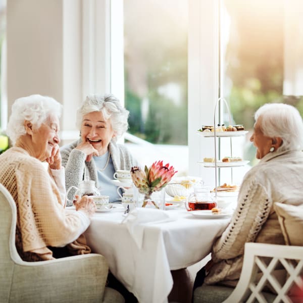 Resident lady friends enjoying Sunday brunch together at West Park Senior Living in San Dimas, California