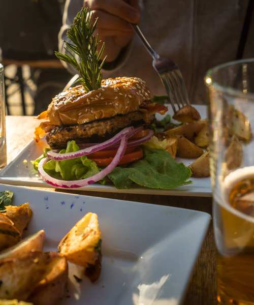 A burger and fries on a plate in a restaurant near Copper Range in Colorado Springs, Colorado