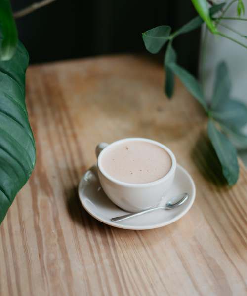 Cup of coffee on a table near Chambersburg Family Townhomes in Chambersburg, Pennsylvania