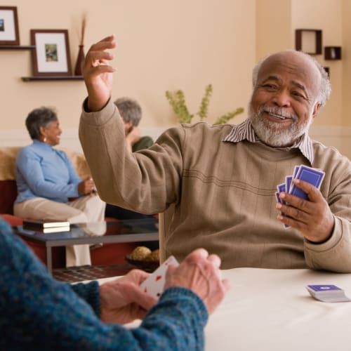 Resident playing cards at Innovation Senior Living in Winter Park, Florida