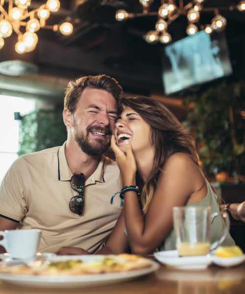 Couple having meal at a restaurant near Stony Brook Village in Hyde Park, Massachusetts