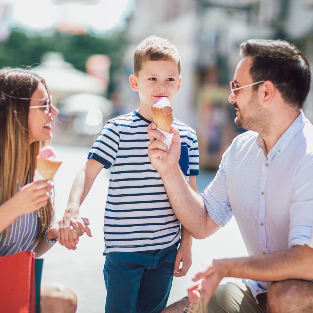 A happy family having ice cream near Discovery at Craig Ranch in McKinney, Texas