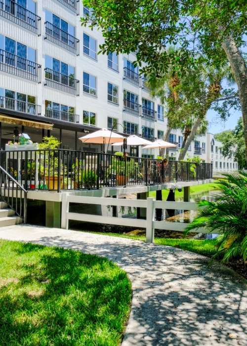 Paved walkway in a beautiful and lush environment at Silver Creek in St. Augustine, Florida