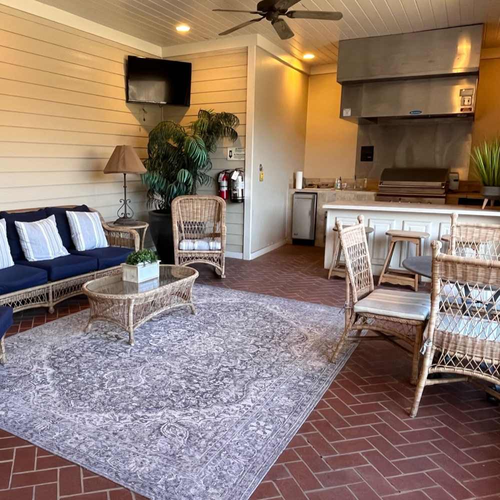 Community barbeque area with plenty of seating at Verandas at Mitylene in Montgomery, Alabama, 