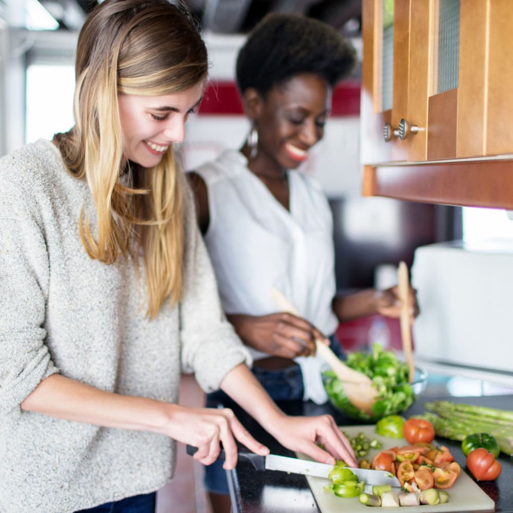 Resident couple cooking food in their new apartment at Garden City/Apple Garden in Garden City, Kansas