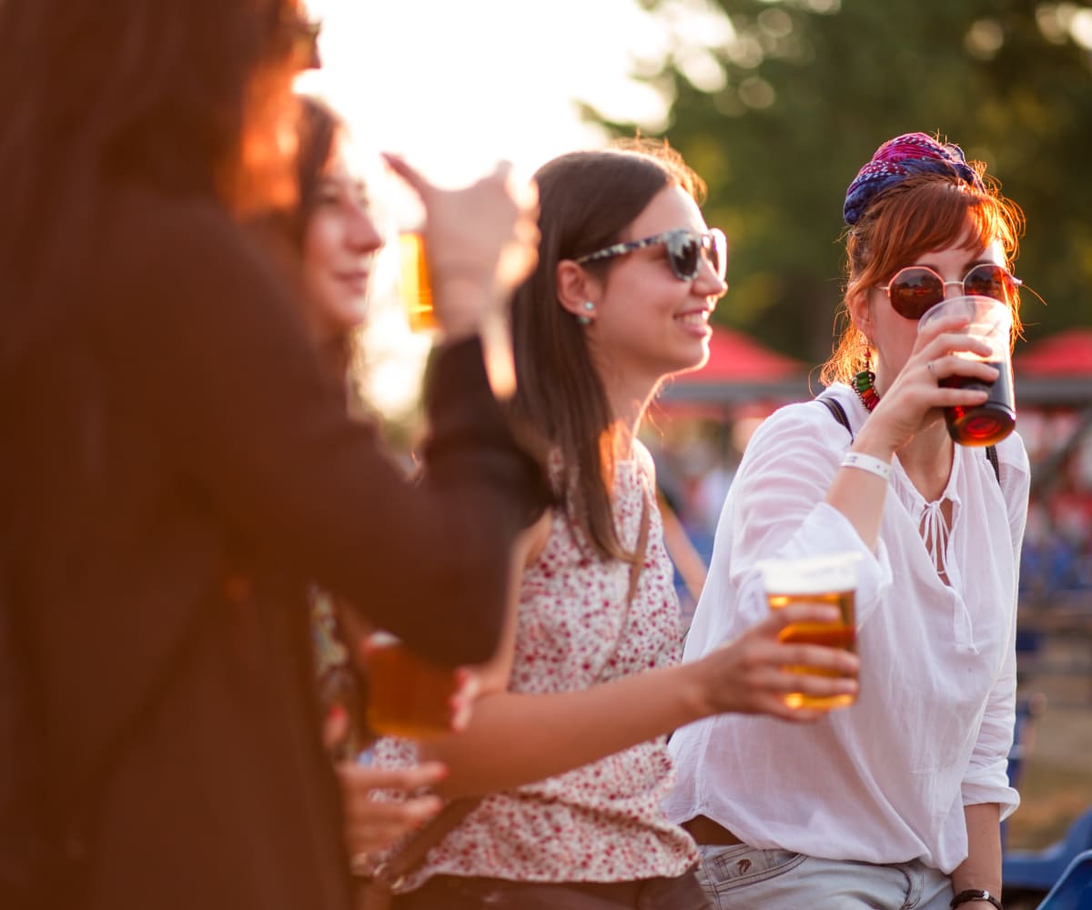 Women enjoying a drink outside near Winchester Apartments in Amarillo, Texas