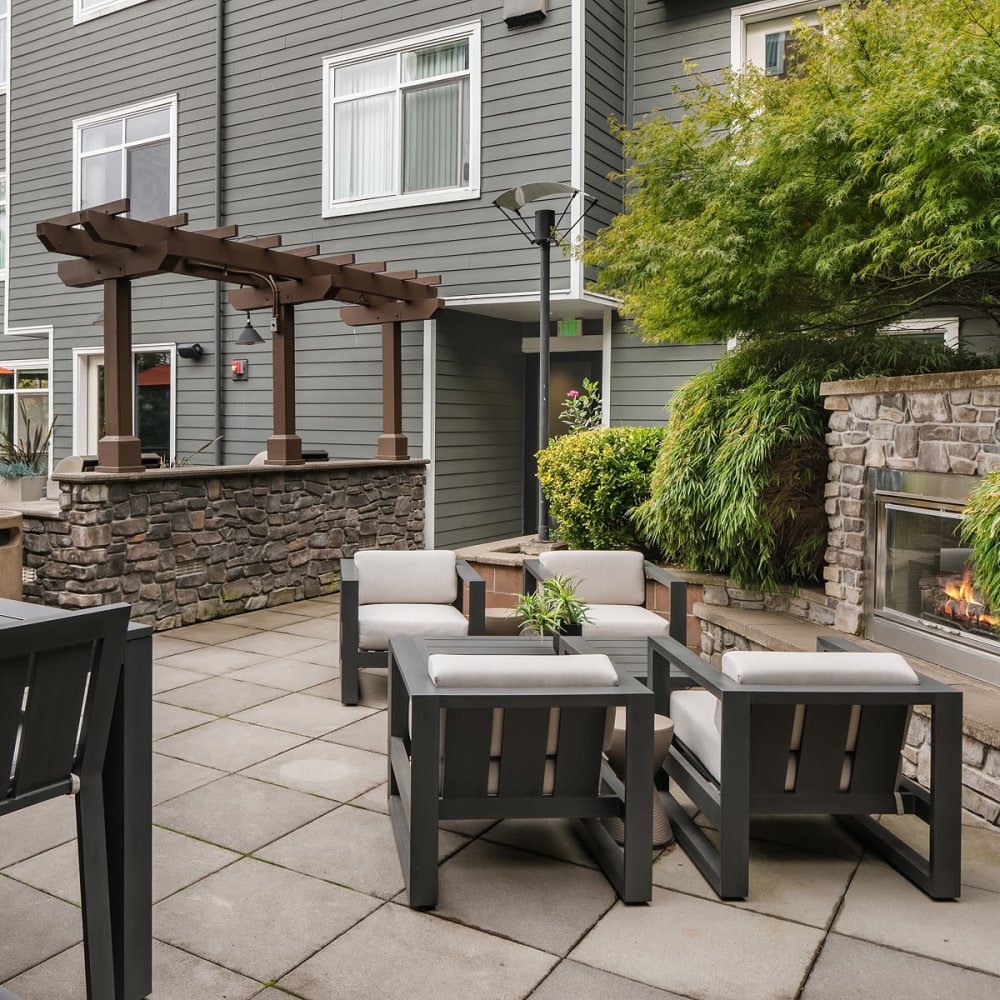 Red patio seating with fireplace at Chateau Woods in Woodinville, Washington