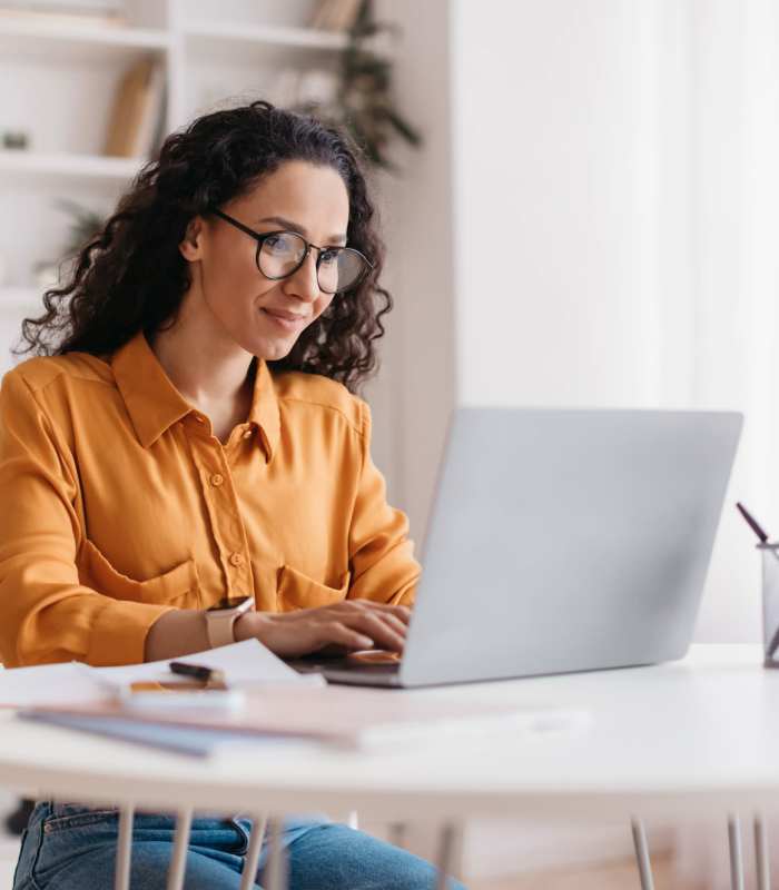 Resident using her laptop at Edgewood Group Apartments in Merrillville, Indiana
