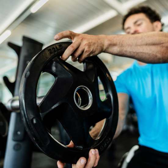 Resident in the community fitness center at The Millwright in Cornelius, North Carolina