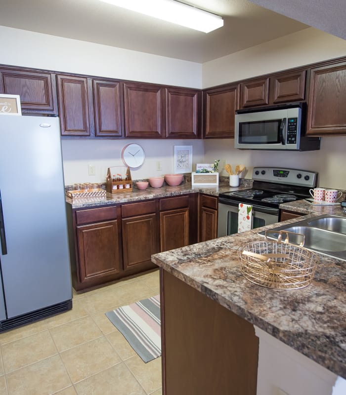 Kitchen with granite countertops at Fountain Lake in Edmond, Oklahoma