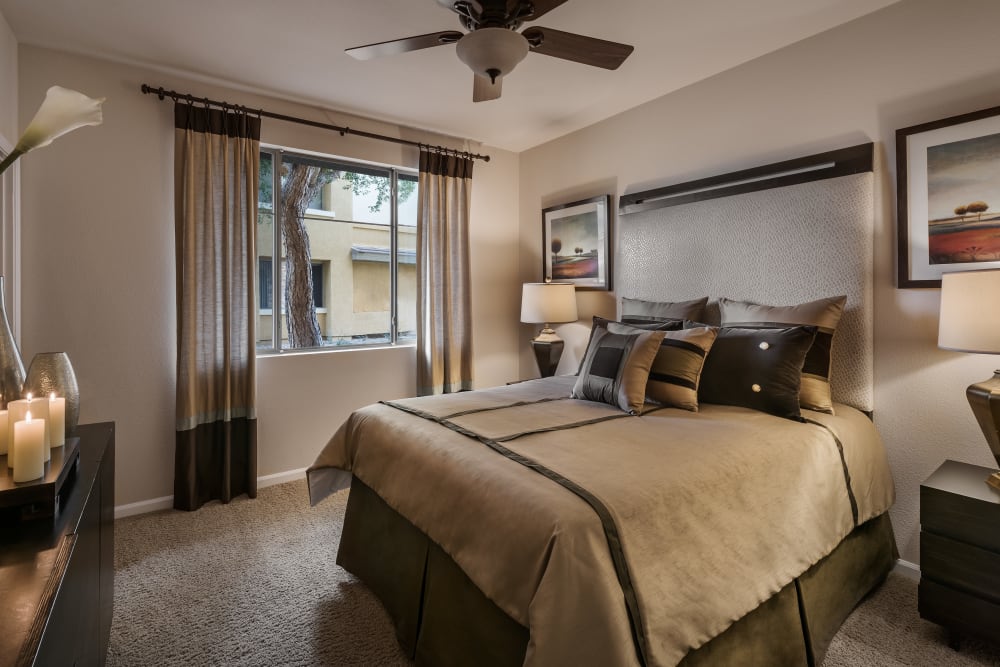 Large master bedroom with ceiling fan and beautiful furnishings in model home at Borrego at Spectrum in Gilbert, Arizona