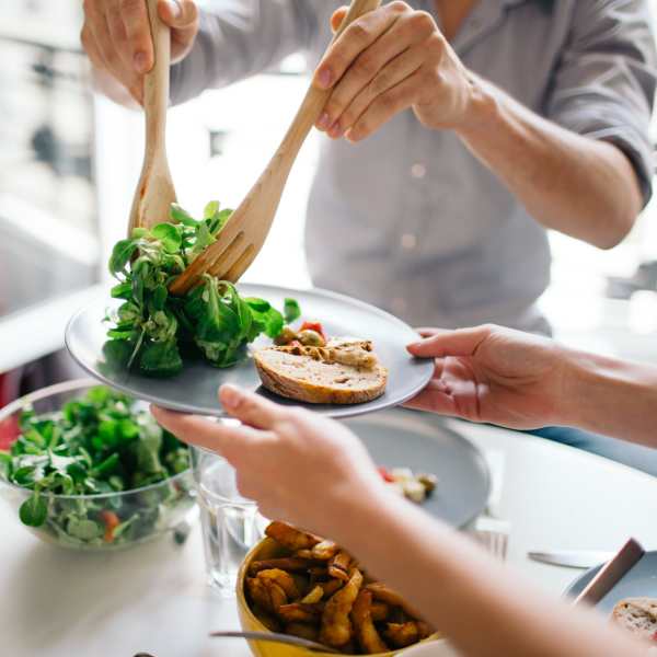 Residents enjoy a fresh meal near Attain on 5th, Charlottesville, Virginia