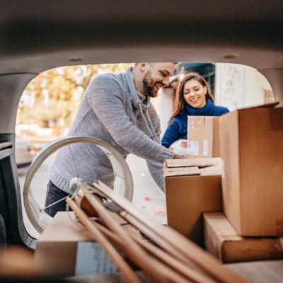 customers loading their car at Storage Near Me - White Oak Storage in North Little Rock, Arkansas