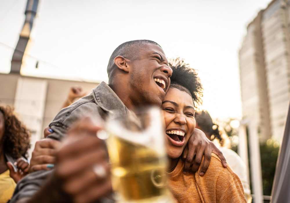 Couple enjoying drinks near Edgewood Group Apartments in Merrillville, Indiana