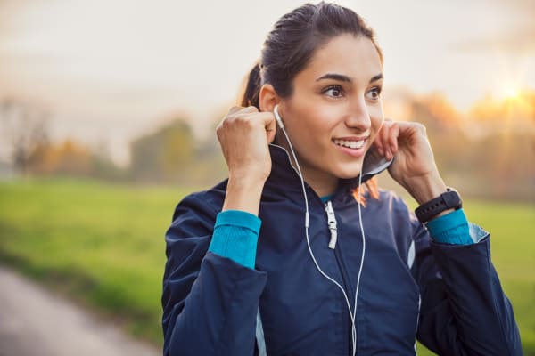 Woman preparing for a jog near Avilla Camelback Ranch in Phoenix, Arizona