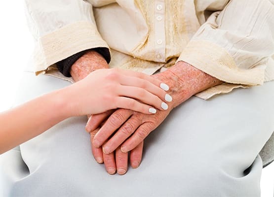 Caregiver showing compassion for resident at The Retreat at Lady's Island in Beaufort, SC